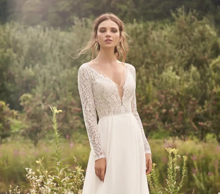 Photo of model wearing a long sleeves style gown