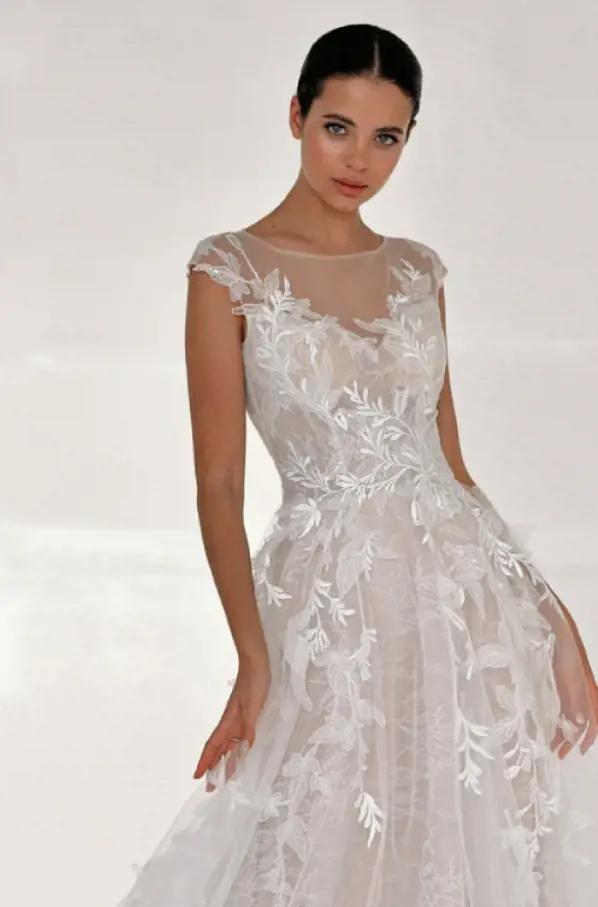 Photo of model wearing a white gown by Belfaso