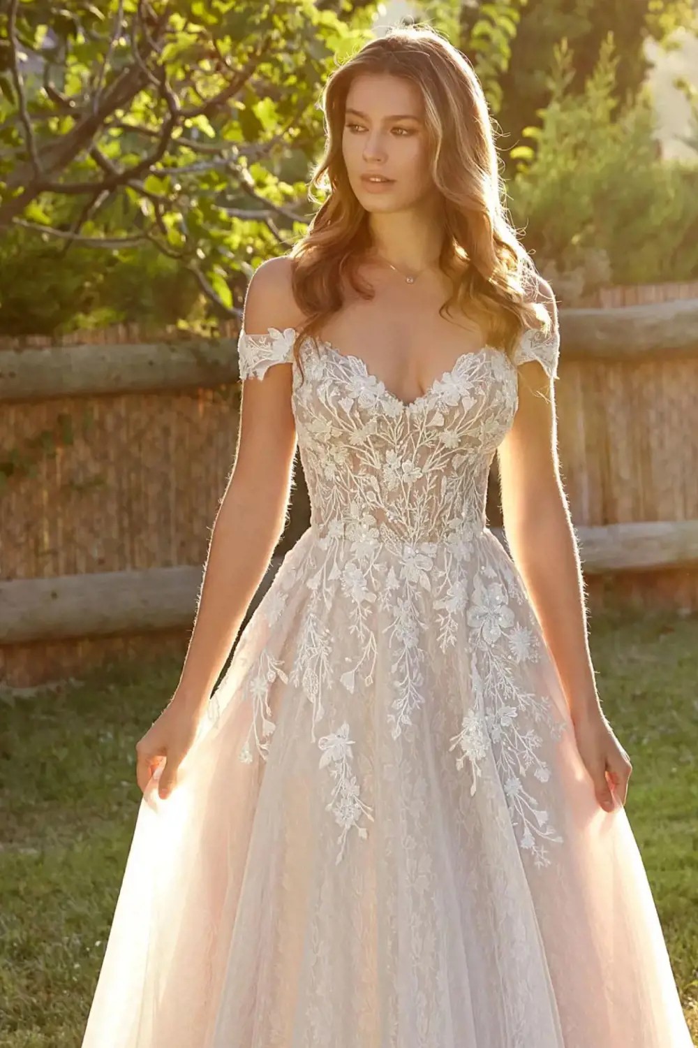 Photo of model wearing a white gown by Eddy K