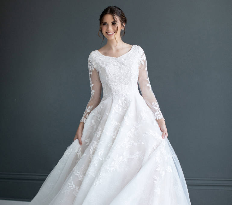 Photo of model wearing a capped sleeves style gown