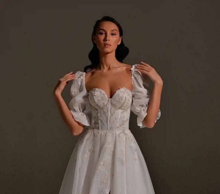 Photo of model wearing a ballgown style gown