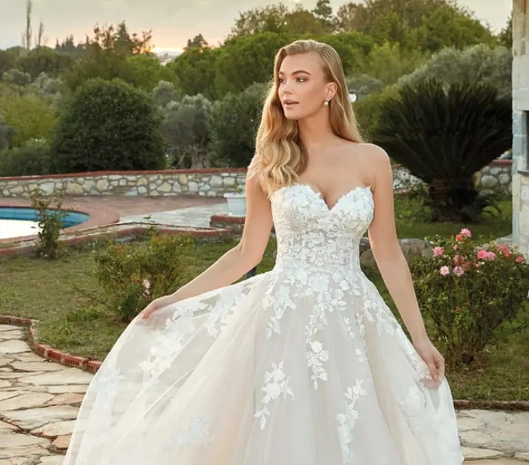 Photo of model wearing a plus size style gown